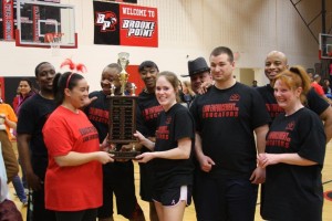 Members of the Stafford Sheriff's Office Juvenile Services Unit accepted the winner's trophy from the Educator's team coach.