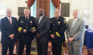 Del. Tom Rust (left) and DMV Commissioner Richard Holcomb, Transportation Safety Committee (right) award Sheriff Chapman, Monroe Tech Principal Wagner Grier and Major John Fraga the Governor's Transportation Award for Youth Traffic Safety (No Texting and Driving Campaign) at the Virginia State House.  