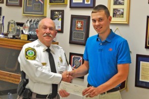 Wythe County Sheriff Doug King presents Michael Hancock of Wytheville, VA with a scholarship check for $1,000.